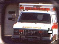 Ambulance seen in rear view mirror appears correct 